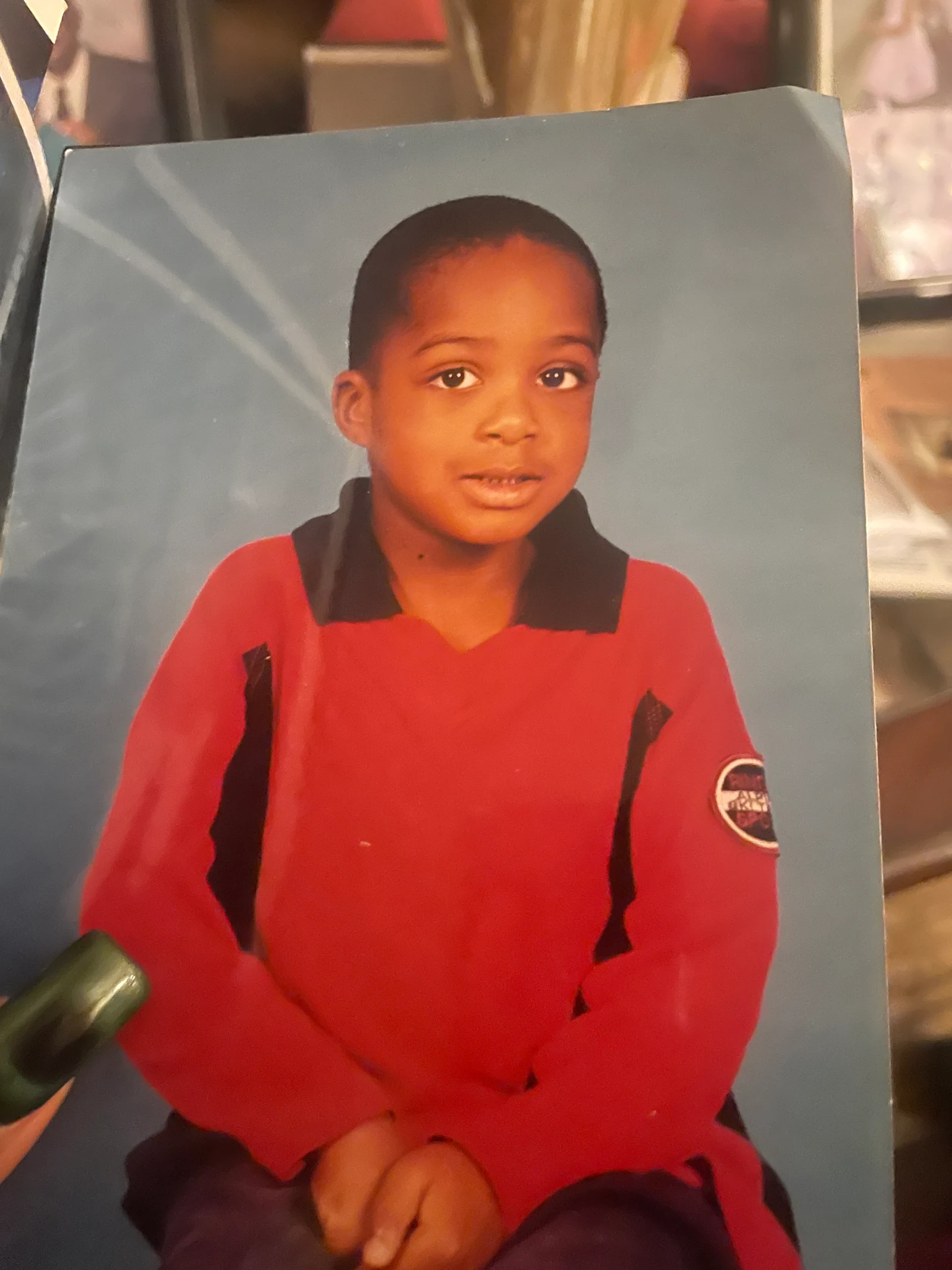 Original child portrait in a red polo used as the reference for a precise GPT Image 2.5 edit
